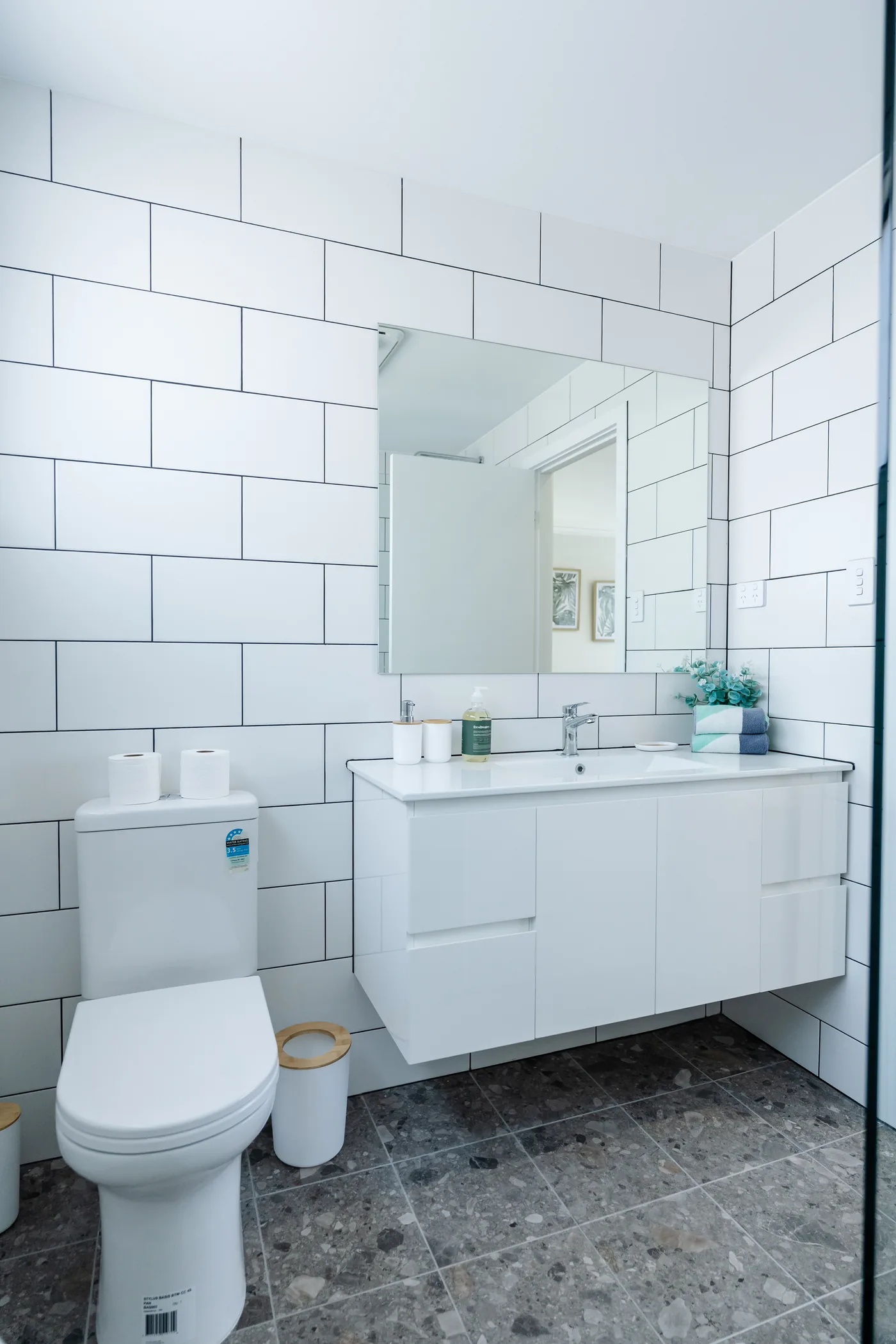 Walk-in subway-tiled rain shower