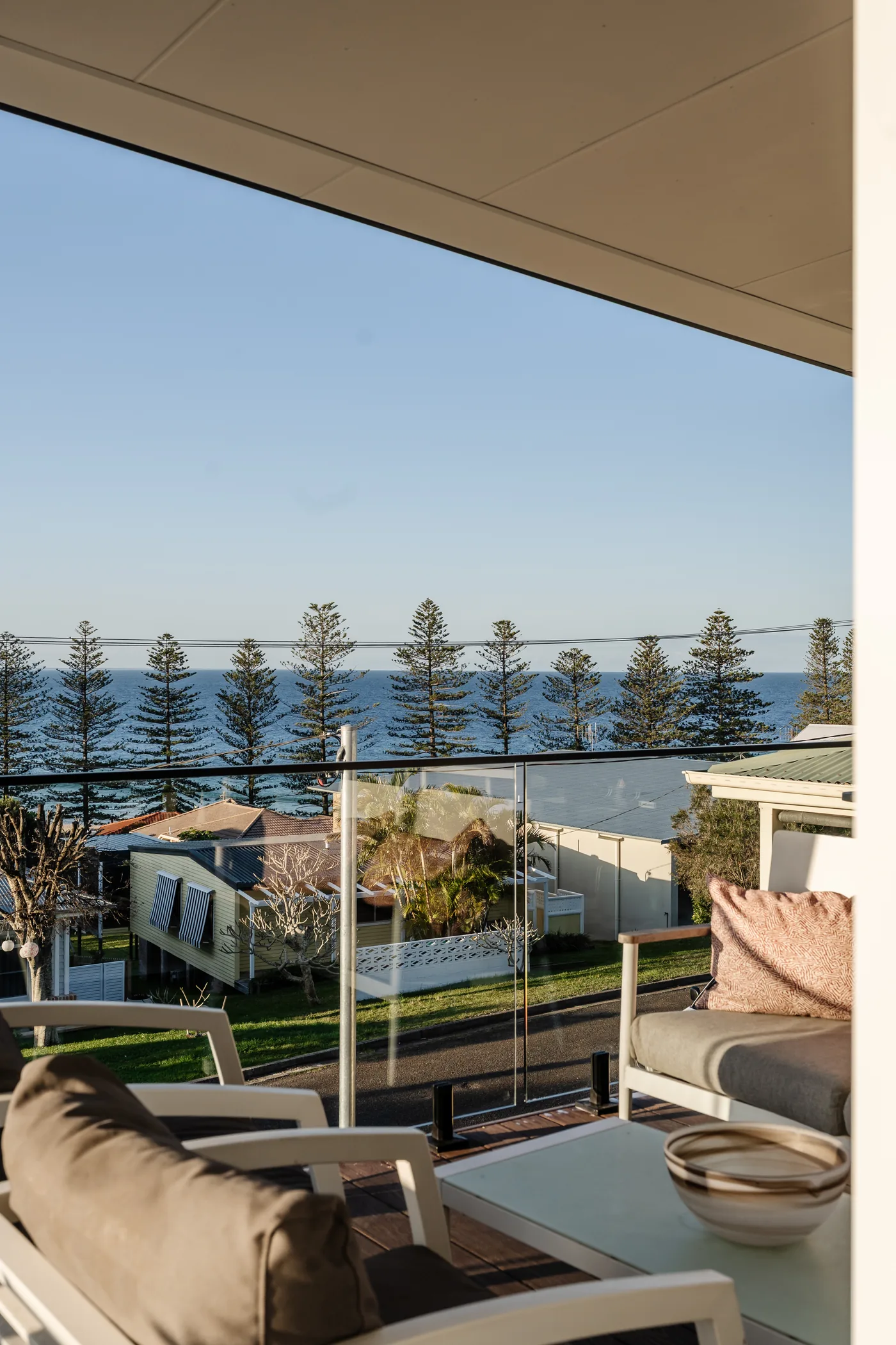 View through the Norfolk pines to the sea