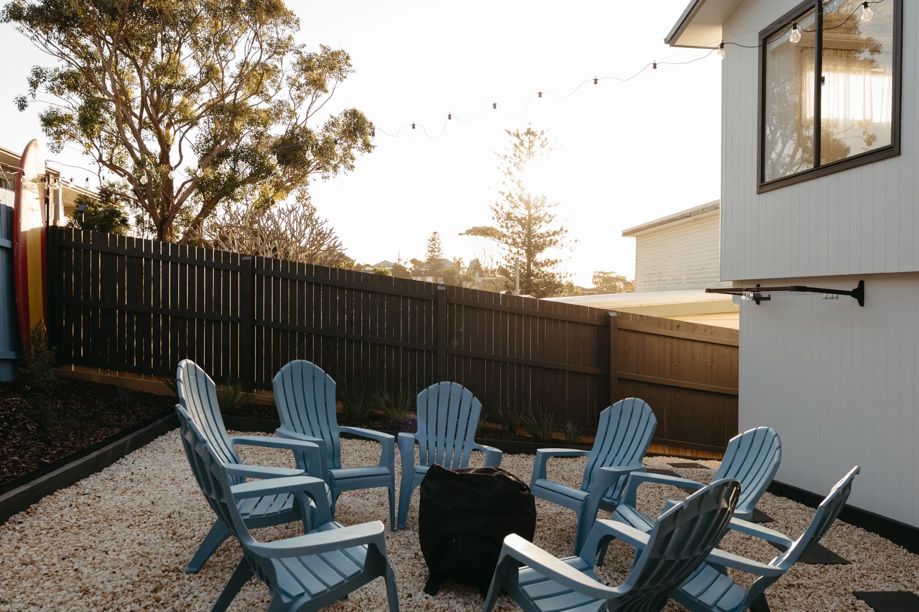 Backyard fire pit at dusk