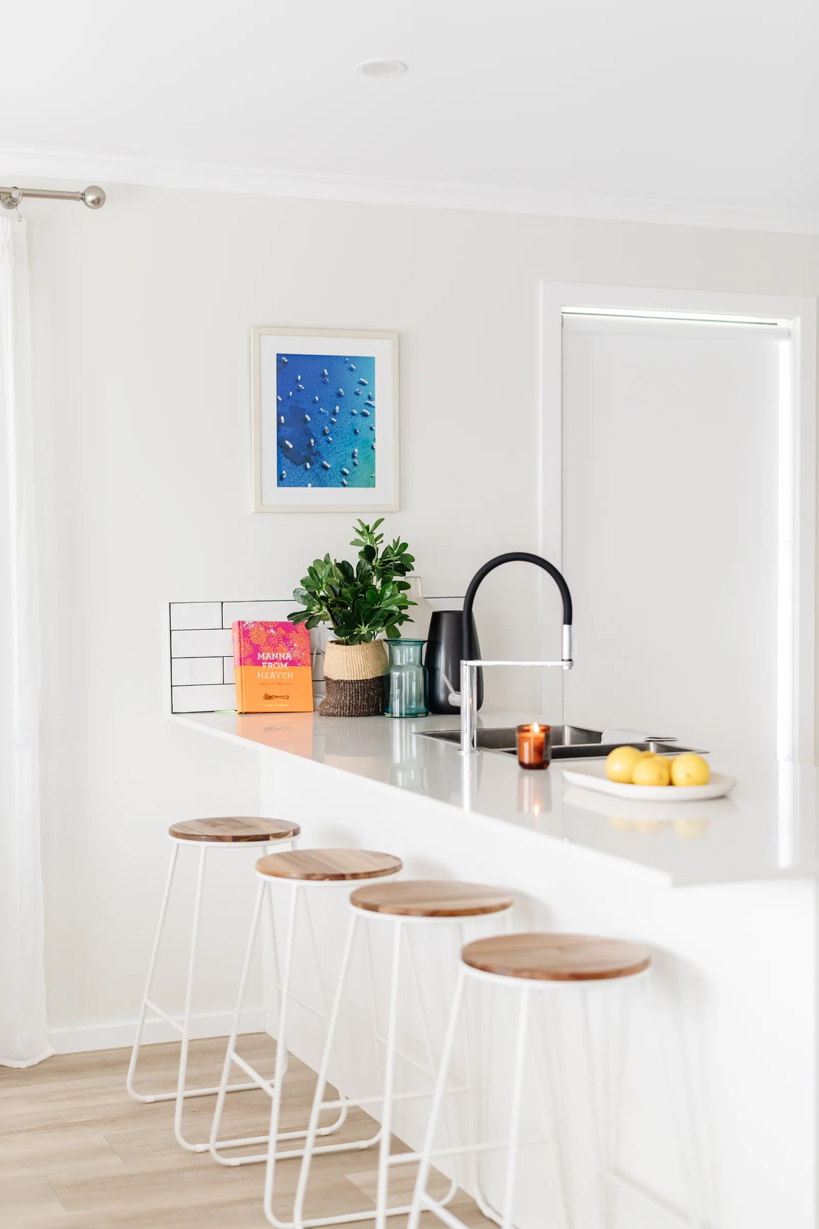 Kitchen detail with coastal artwork